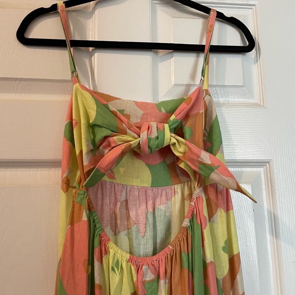 Midi sanctuary dress with bow-tie-back and bottom tier ruffle in floral pastel